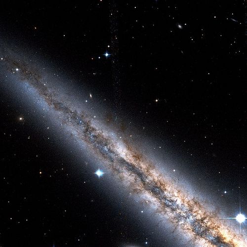 Dark_nebula_rift_in_NGC_891_Hubble_north_part.jpg